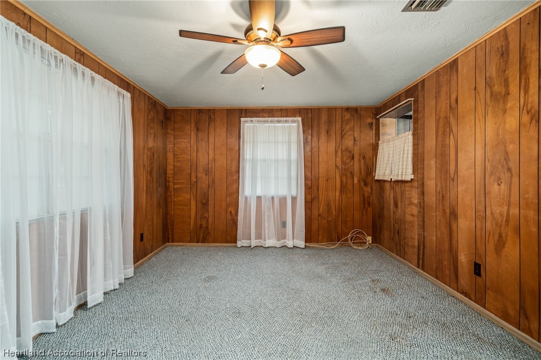 1221 Forest Road Sebring, FL 33872 - Photo 21 of 31 wooden floor and windows in a room