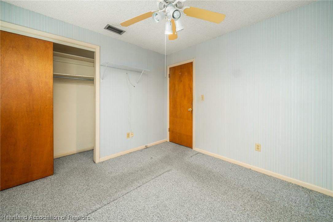 1221 Forest Road Sebring, FL 33872 - Photo 23 of 31 an empty room with a ceiling fan and a window