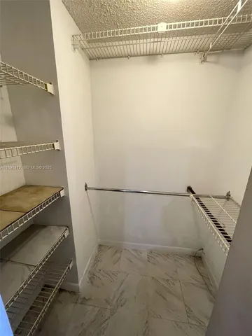 a view of a room with racks on the wall