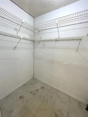 a view of a room with racks on the wall