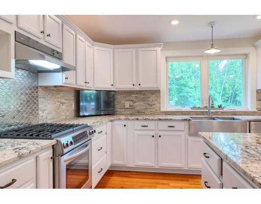 13 Squareshire Road Sterling, MA 01564 - Photo 7 of 32 a kitchen with stainless steel appliances granite countertop a stove a sink and a white cabinets