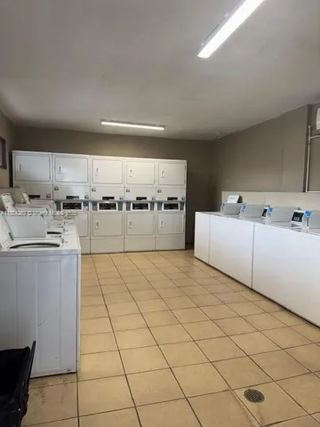 a view of a swimming pool with a lounge chair