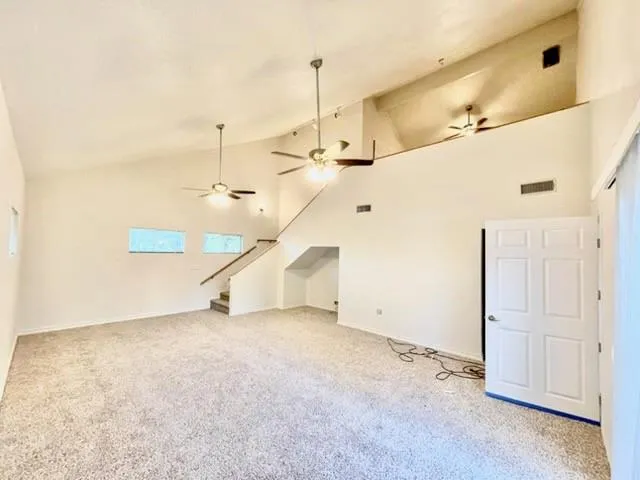 a view of a ceiling fan and entryway