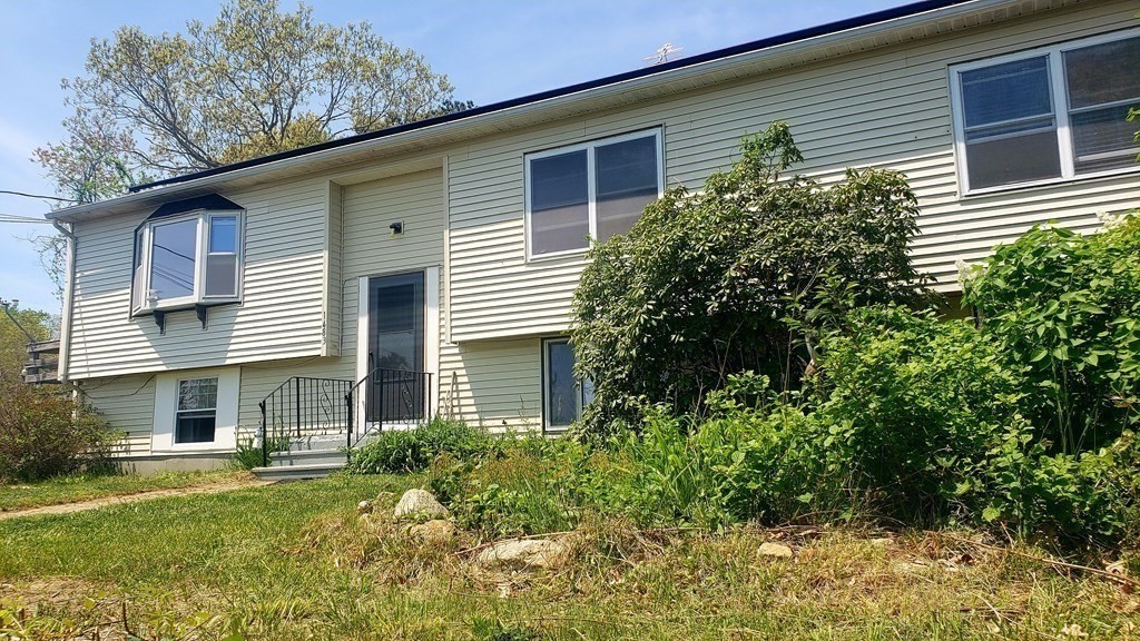 1483 State Road Plymouth, MA 02360 - Photo 3 of 27 a front view of a house with a yard