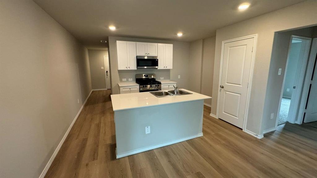 5541 Flannel Lane Krum, TX 76249 - Photo 1 of 13 a room with wooden floor and furniture