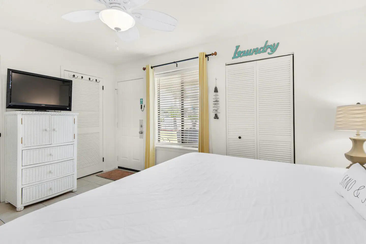 60 Sandprints Drive, Unit E3 Miramar Beach, FL 32550 - Photo 11 of 26 a bedroom with a bed and a flat screen tv