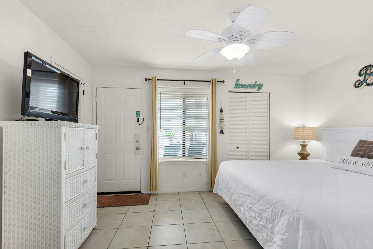 60 Sandprints Drive, Unit E3 Miramar Beach, FL 32550 - Photo 12 of 26 a spacious bedroom with a bed and a flat screen tv