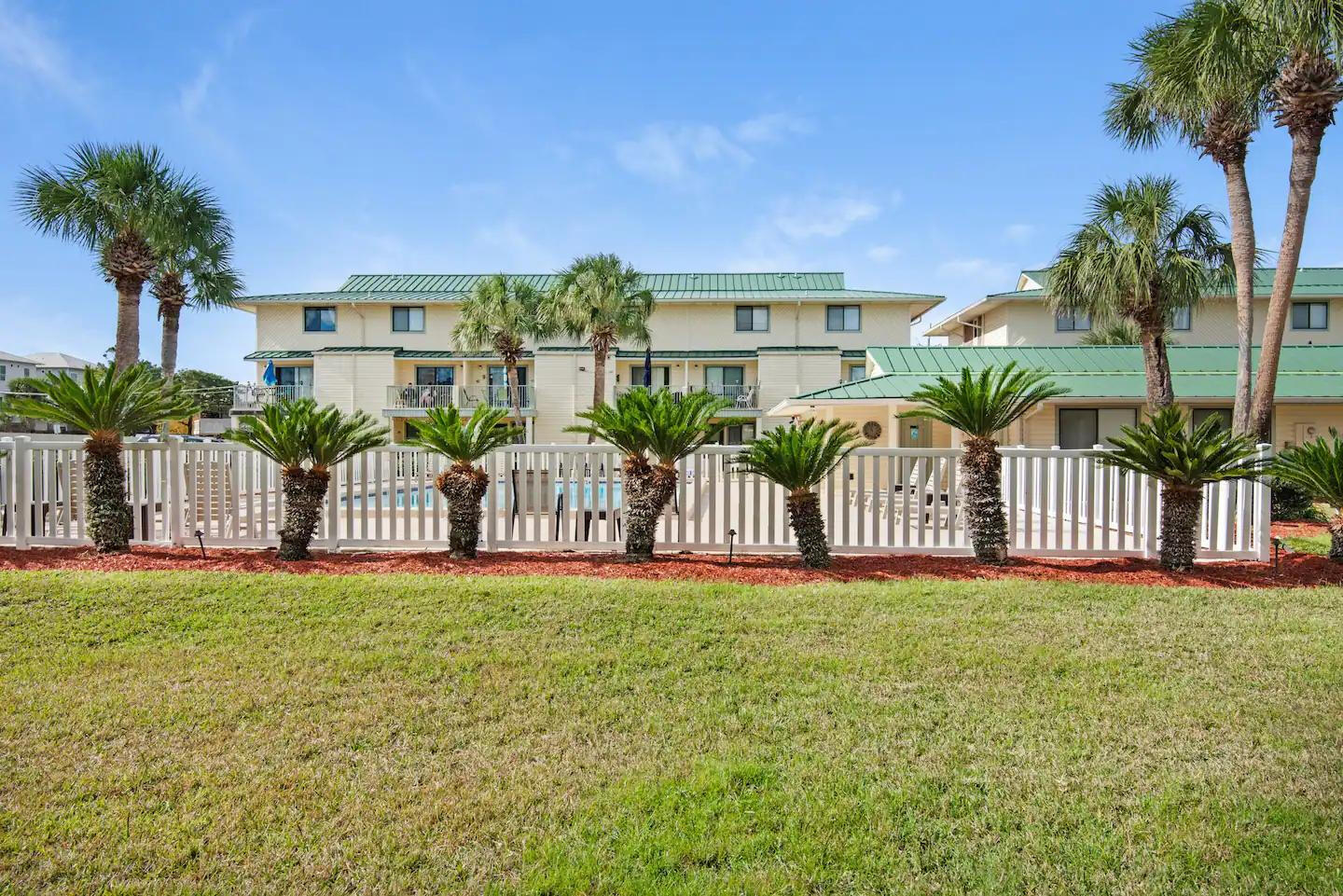 60 Sandprints Drive, Unit E3 Miramar Beach, FL 32550 - Photo 16 of 26 a view of a house with a yard and potted plants