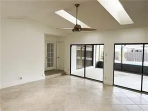 a view of an empty room with sliding glass door