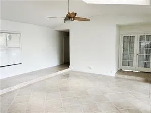 a view of an empty room with windows