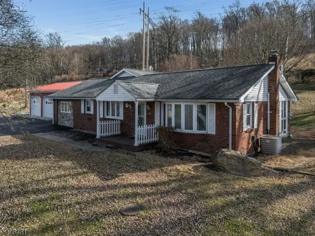 a house with trees in the background