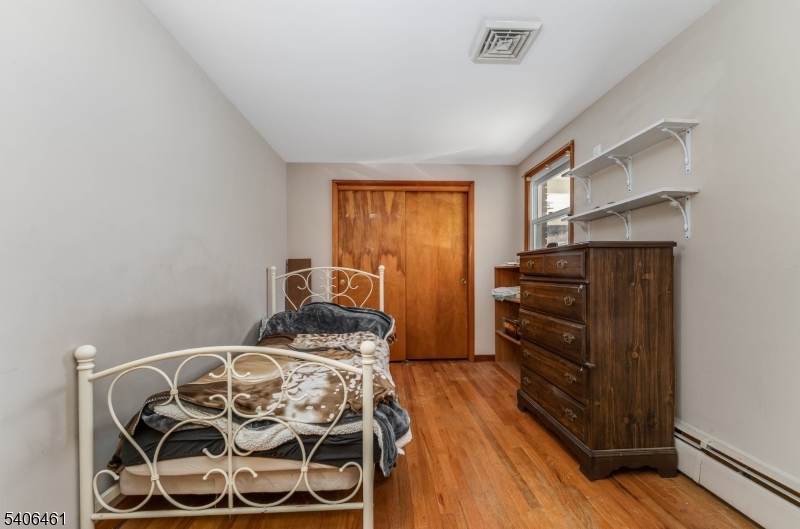 224 Bellis Road Milford, NJ 08848 - Photo 18 of 25 a bedroom with a bed and wooden floor