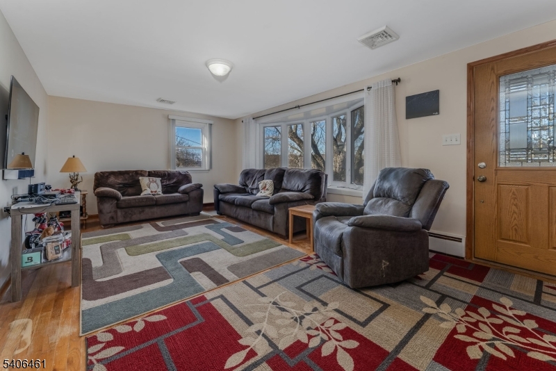 224 Bellis Road Milford, NJ 08848 - Photo 9 of 25 a living room with furniture and a rug