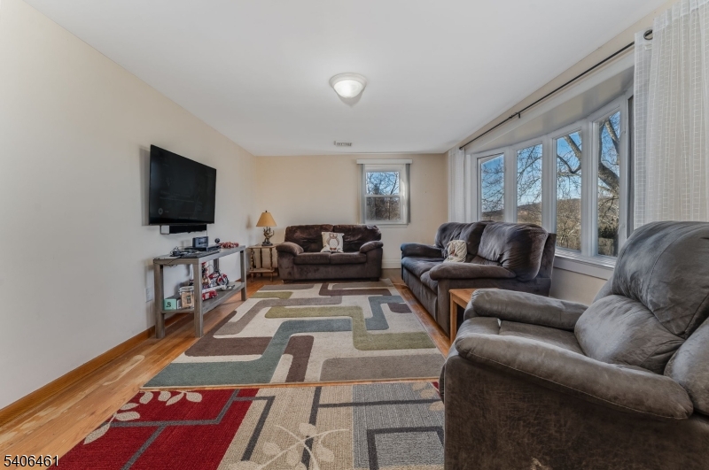 224 Bellis Road Milford, NJ 08848 - Photo 10 of 25 a living room with furniture and a flat screen tv