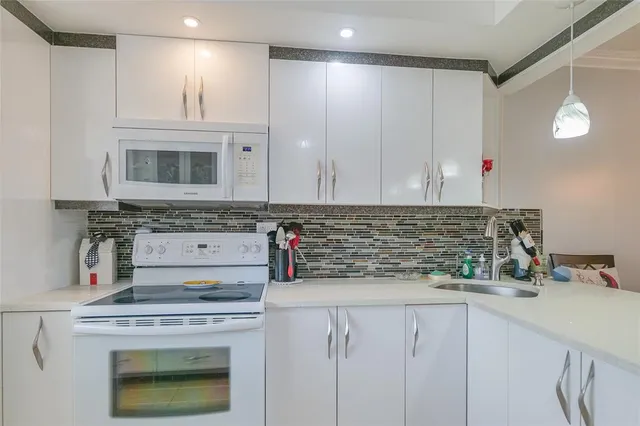 a kitchen with cabinets and window