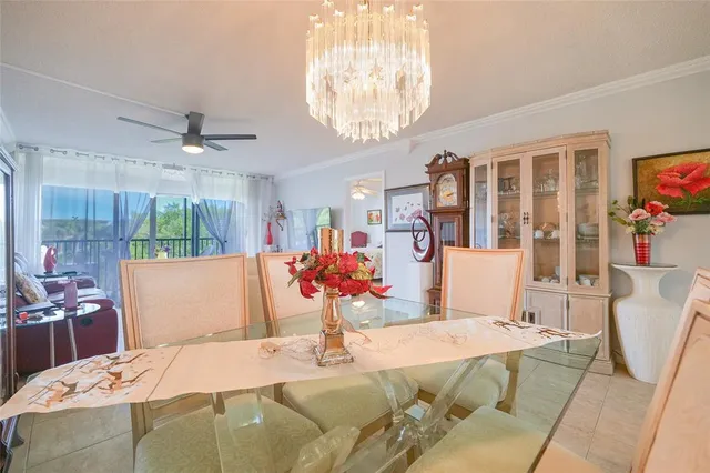 a view of a dining room with furniture and a large window