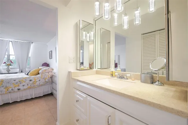 a spacious bathroom with a granite countertop sink toilet and a shower