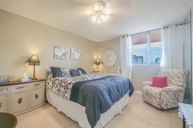 a white toilet sitting next to a bath tub
