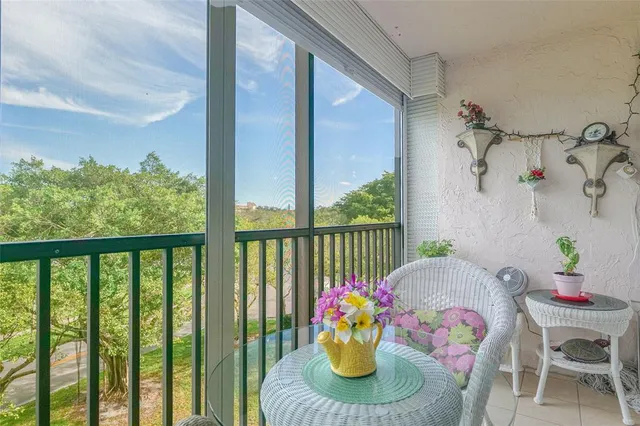 a kitchen with stainless steel appliances granite countertop a sink and a refrigerator