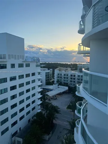 a view of a balcony with chair and table