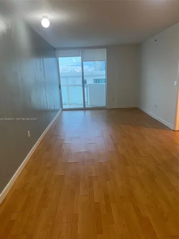 an empty room with a empty space and window