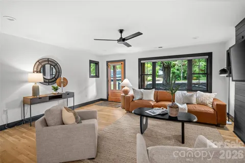 a living room with furniture and a large window