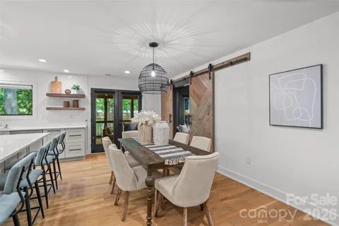 a view of a dining room with furniture window and wooden floor