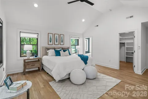 a bedroom with furniture and a rug