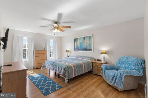 a bedroom with a bed and a couch