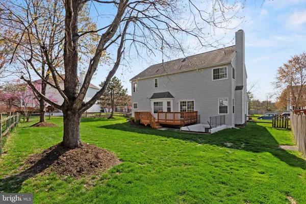 a house view with a sitting space and garden