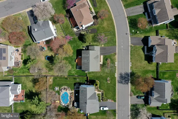 an aerial view of a house with outdoor space