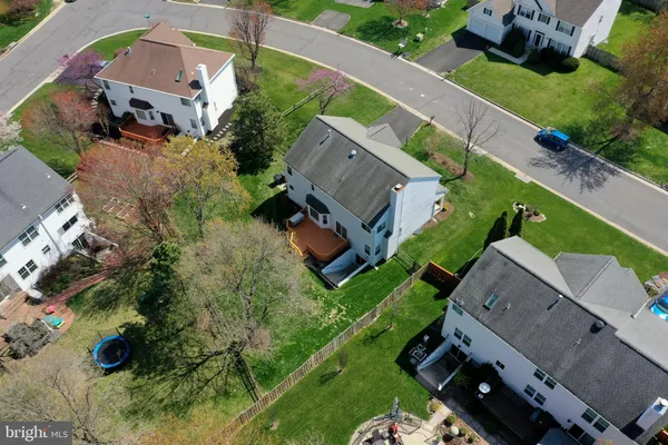 an aerial view of house with a yard