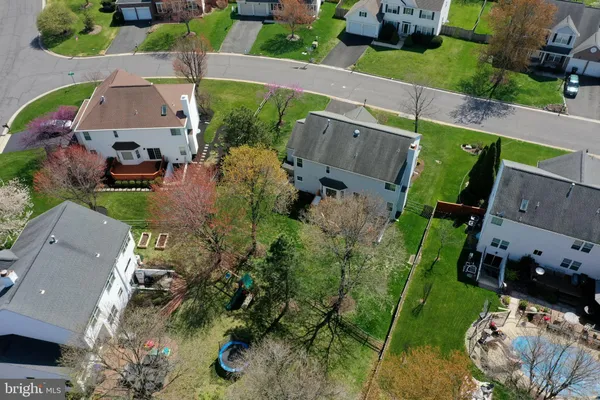 an aerial view of houses with outdoor space