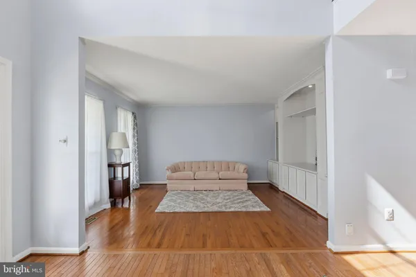 a view of a room with wooden floor and staircase