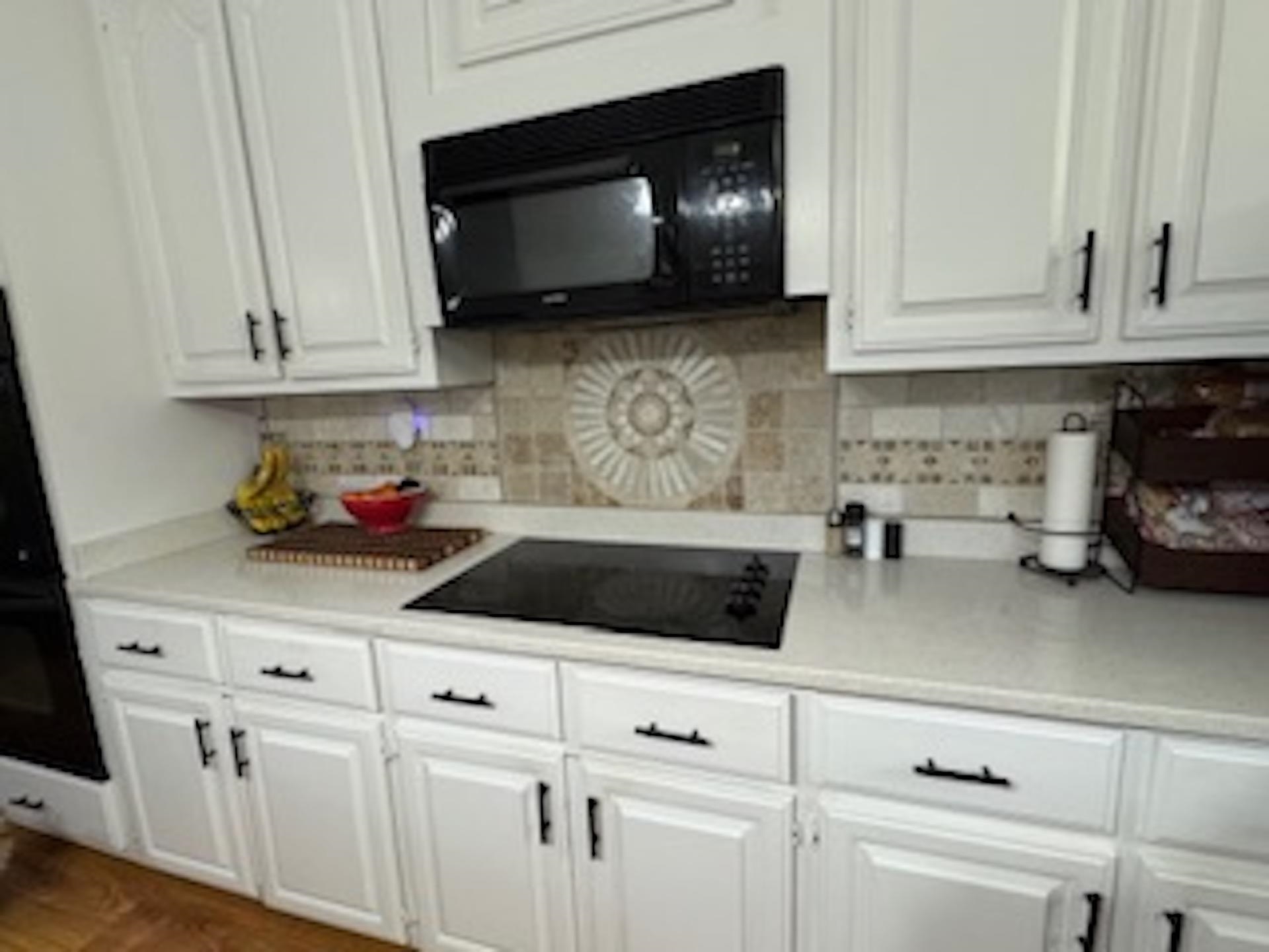 4500 New Brownsville Road Memphis, TN 38135 - Photo 6 of 23 a kitchen with white cabinets and sink