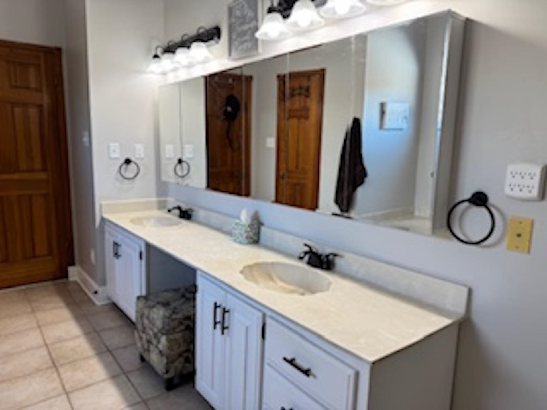 4500 New Brownsville Road Memphis, TN 38135 - Photo 10 of 23 a bathroom with a double vanity sink and a mirror