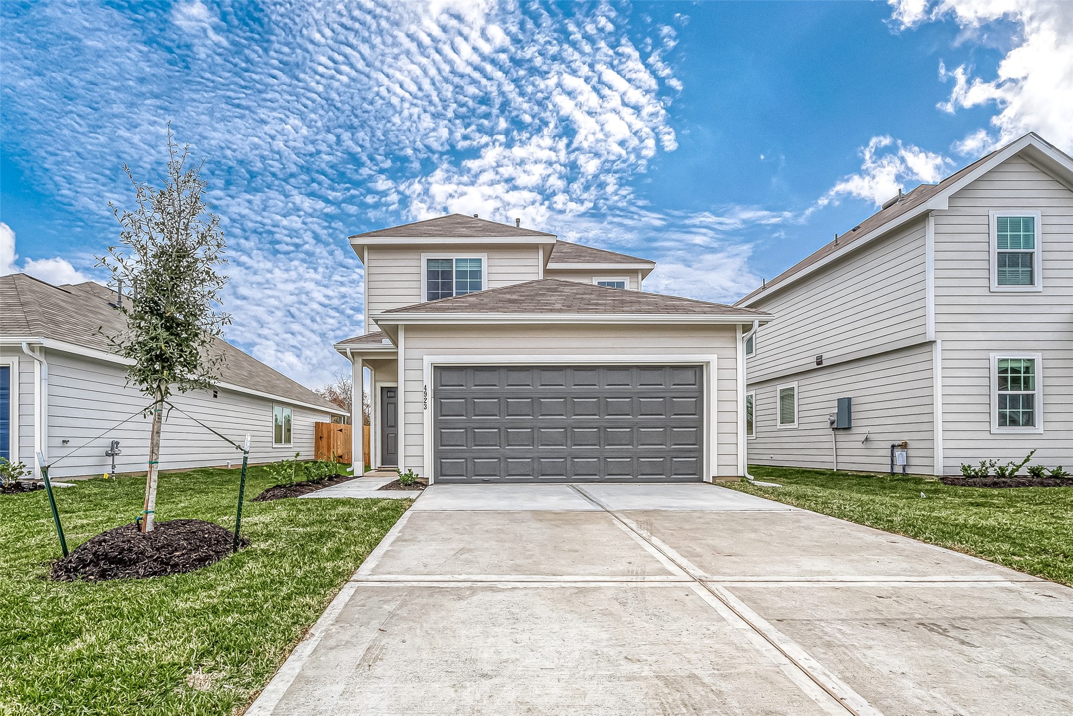 4923 Luke Matthew Drive Rosharon, TX 77583 - Photo 1 of 48 a front view of a house with a yard and garage