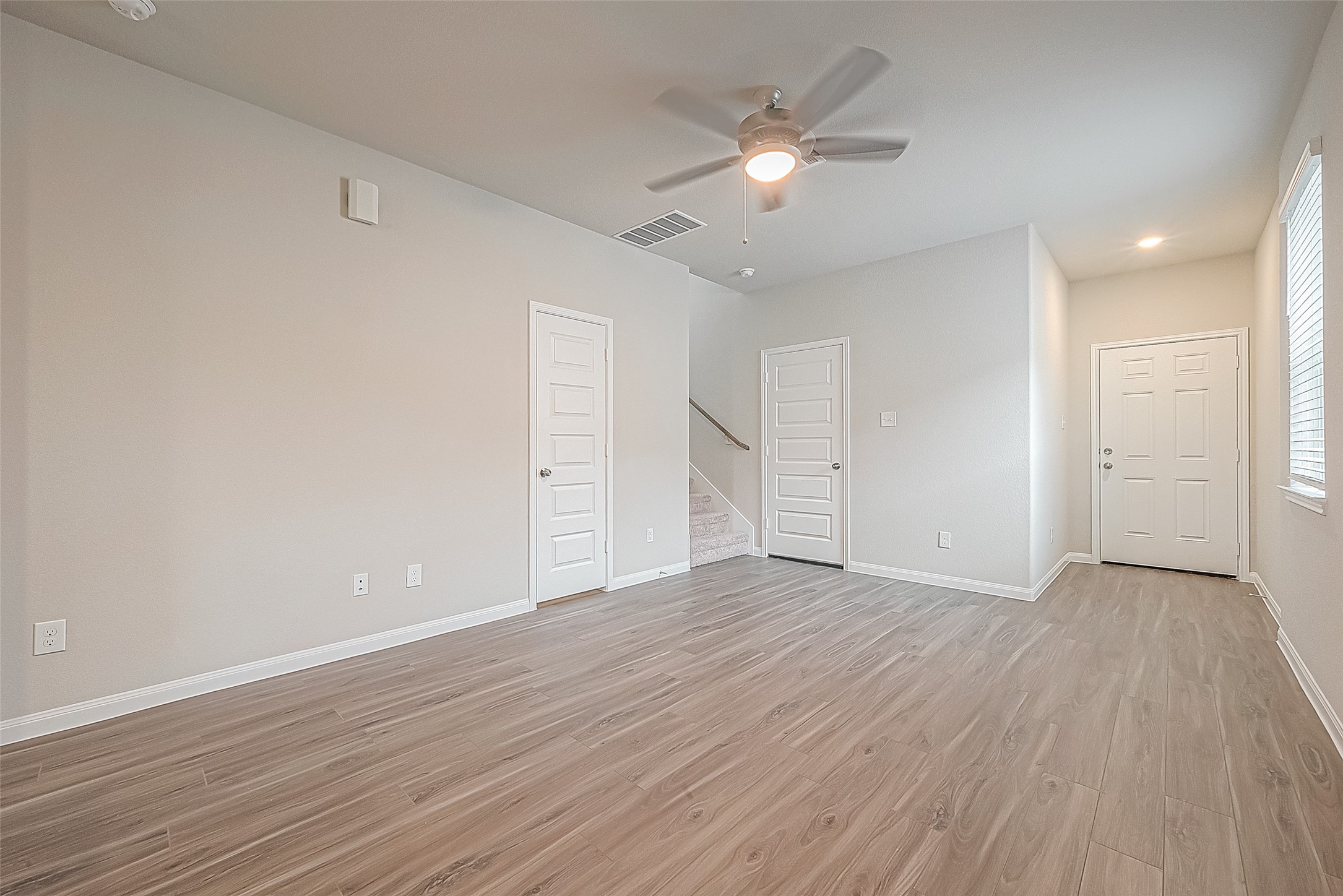 4923 Luke Matthew Drive Rosharon, TX 77583 - Photo 14 of 48 a view of an empty room with wooden floor