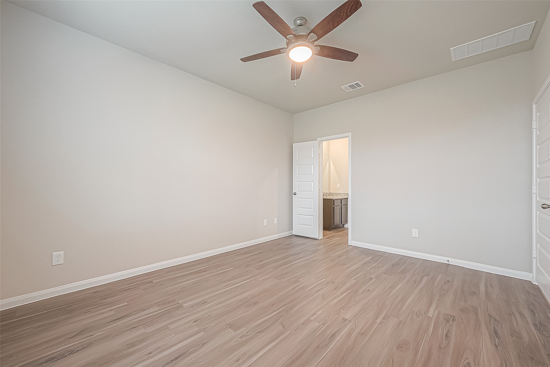 4923 Luke Matthew Drive Rosharon, TX 77583 - Photo 23 of 48 an empty room with wooden floor and ceiling fan