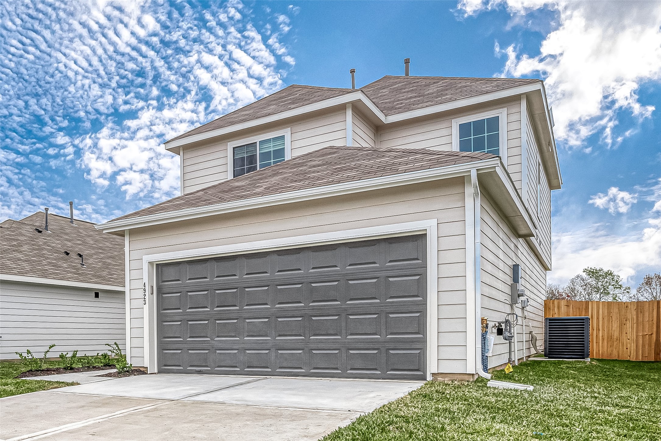 4923 Luke Matthew Drive Rosharon, TX 77583 - Photo 5 of 48 a front view of a house with a garage