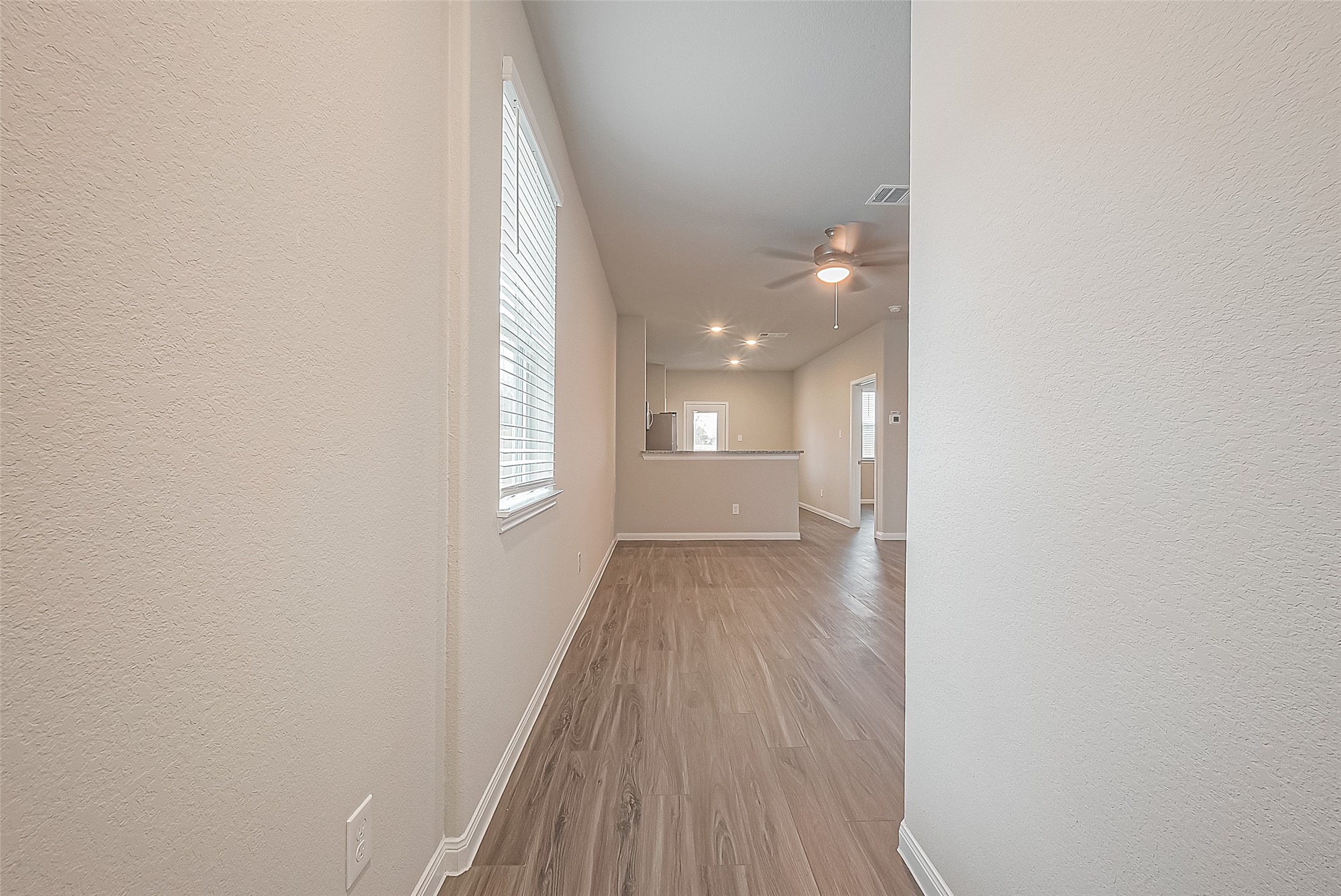 4923 Luke Matthew Drive Rosharon, TX 77583 - Photo 10 of 48 a view of a room with wooden floor and a window