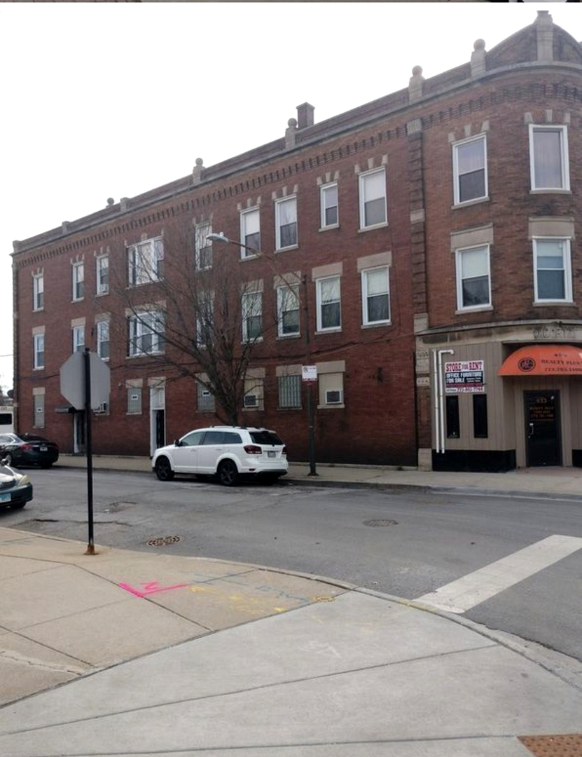 451 East 111th Street, Unit 3R Chicago, IL 60628 - Photo 1 of 7 a car parked in front of a building