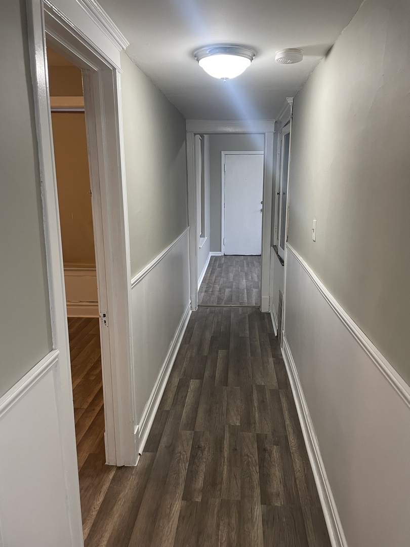 451 East 111th Street, Unit 3R Chicago, IL 60628 - Photo 4 of 7 a view of gallery with wooden floor