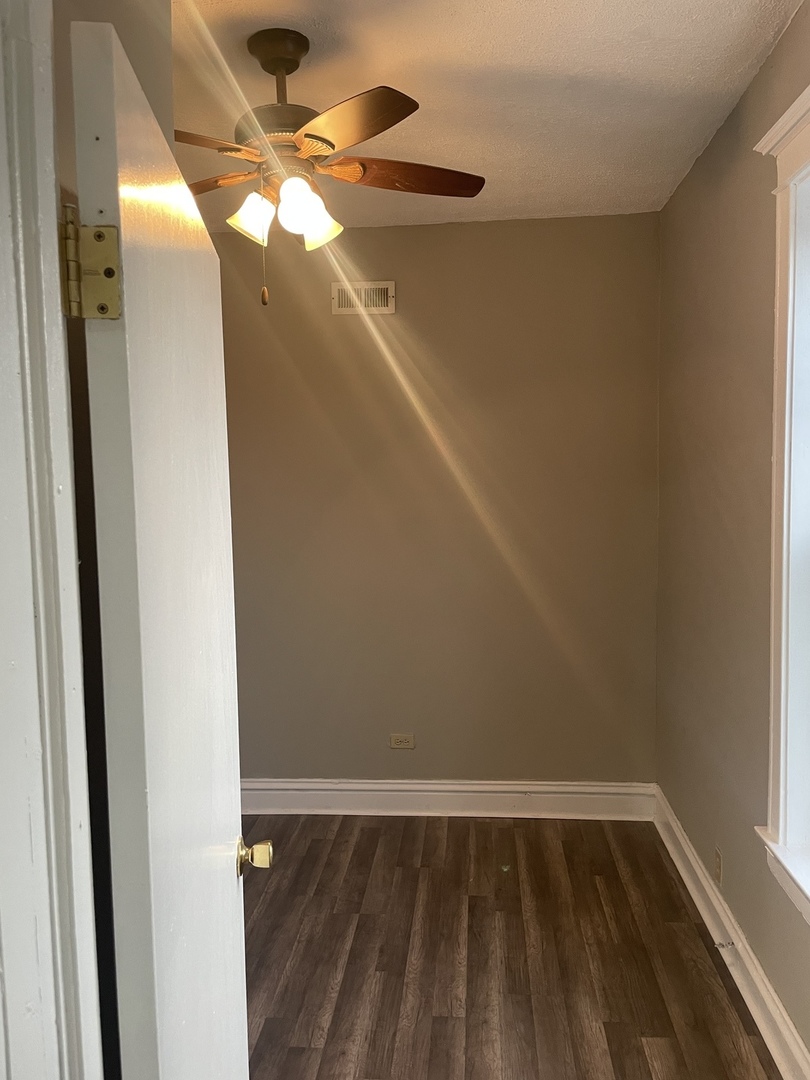 451 East 111th Street, Unit 3R Chicago, IL 60628 - Photo 6 of 7 a view of wooden floor