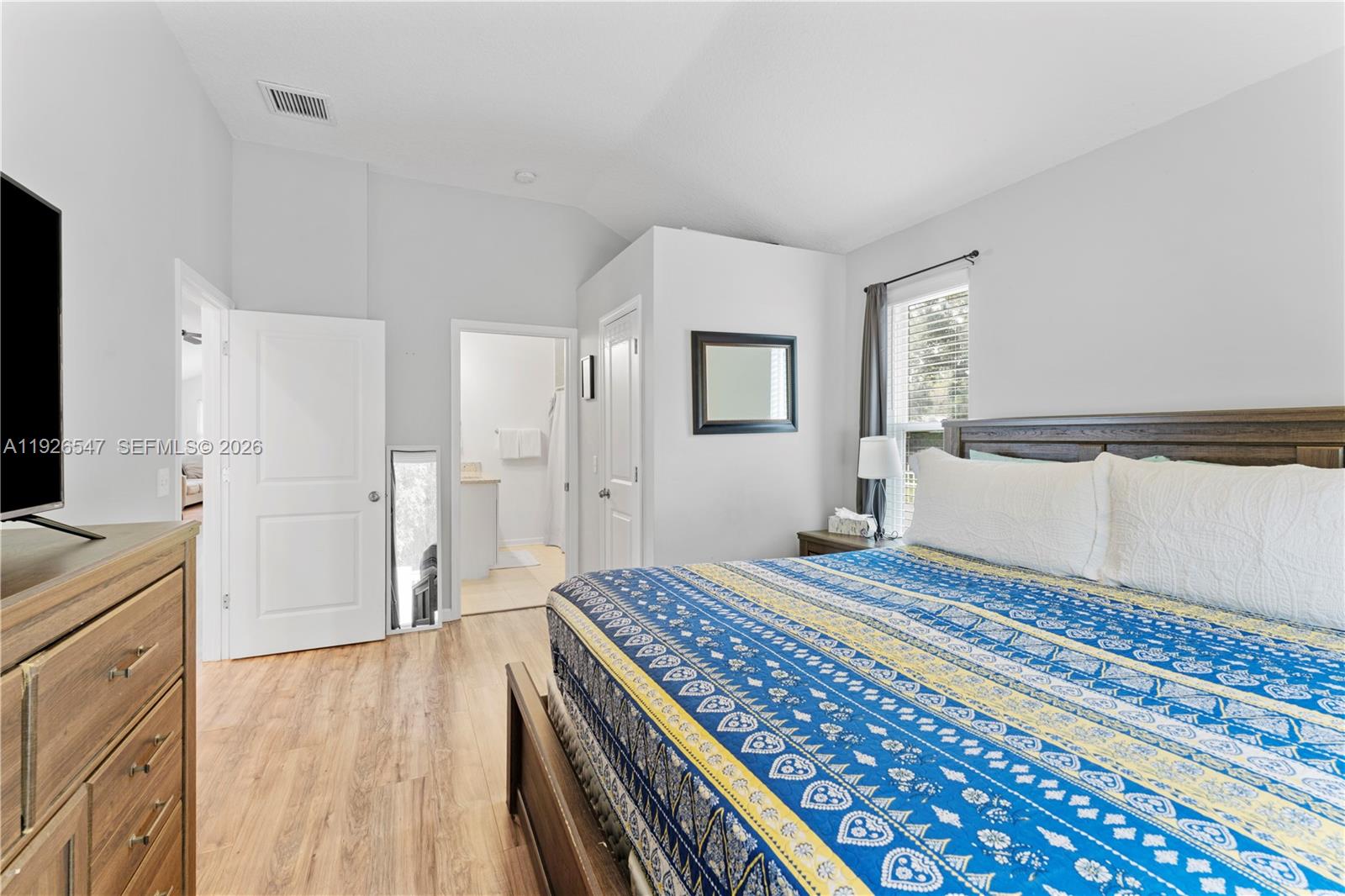 2 Poinciana Cove Road St. Augustine, FL 32084 - Photo 27 of 43 a bedroom with a bed and a flat screen tv