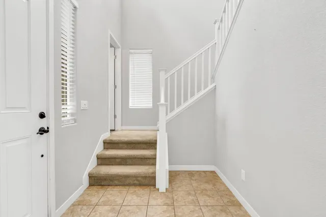 a view of staircase with white walls