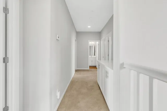 a view of a hallway with a white walls