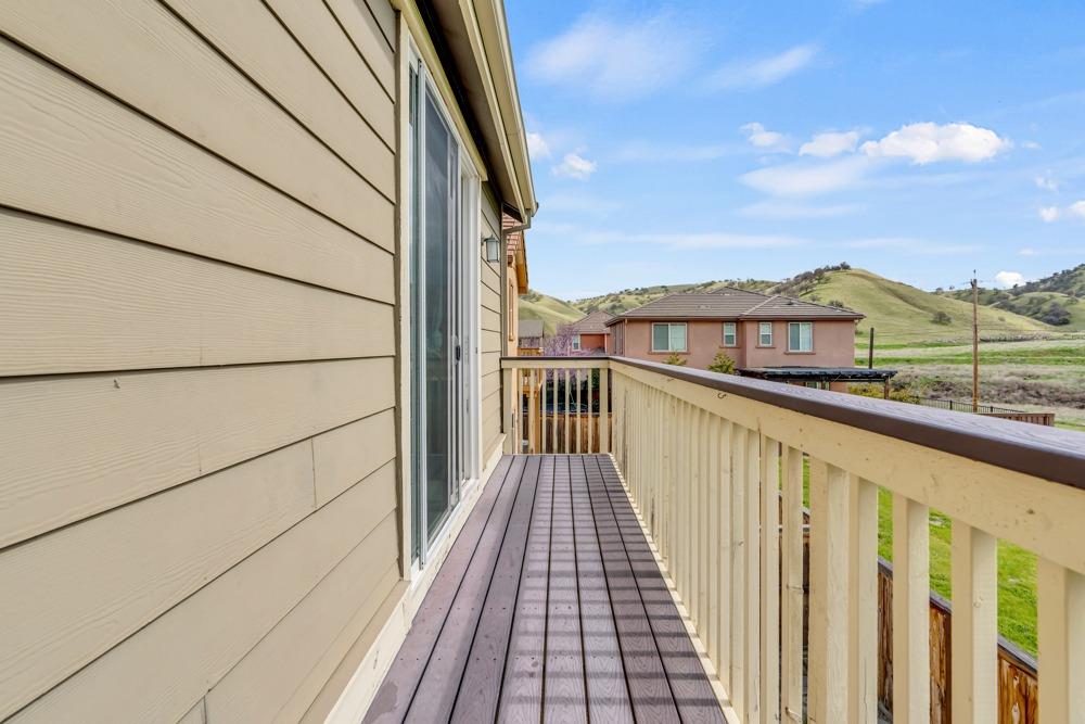 9433 Vintner Circle Patterson, CA 95363 - Photo 30 of 51 a view of a balcony with wooden floor and fence
