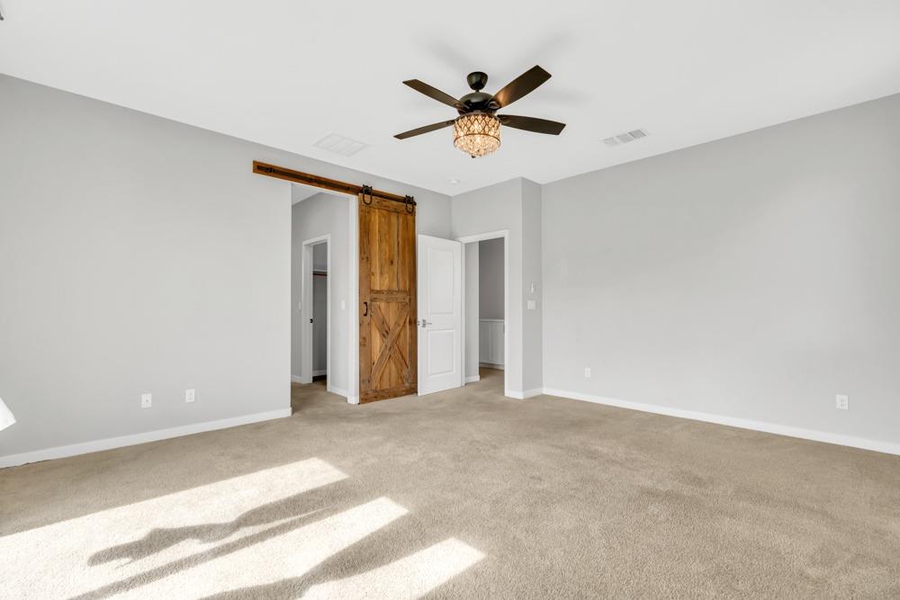 9433 Vintner Circle Patterson, CA 95363 - Photo 31 of 51 a view of a livingroom with a ceiling fan and window