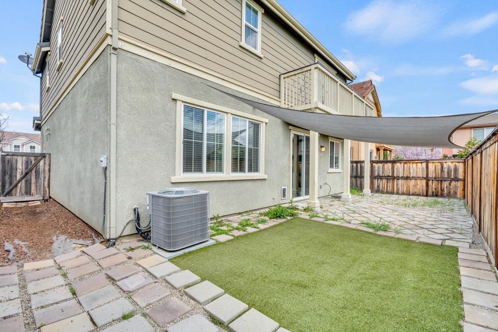 9433 Vintner Circle Patterson, CA 95363 - Photo 42 of 51 a front view of a house with a garden